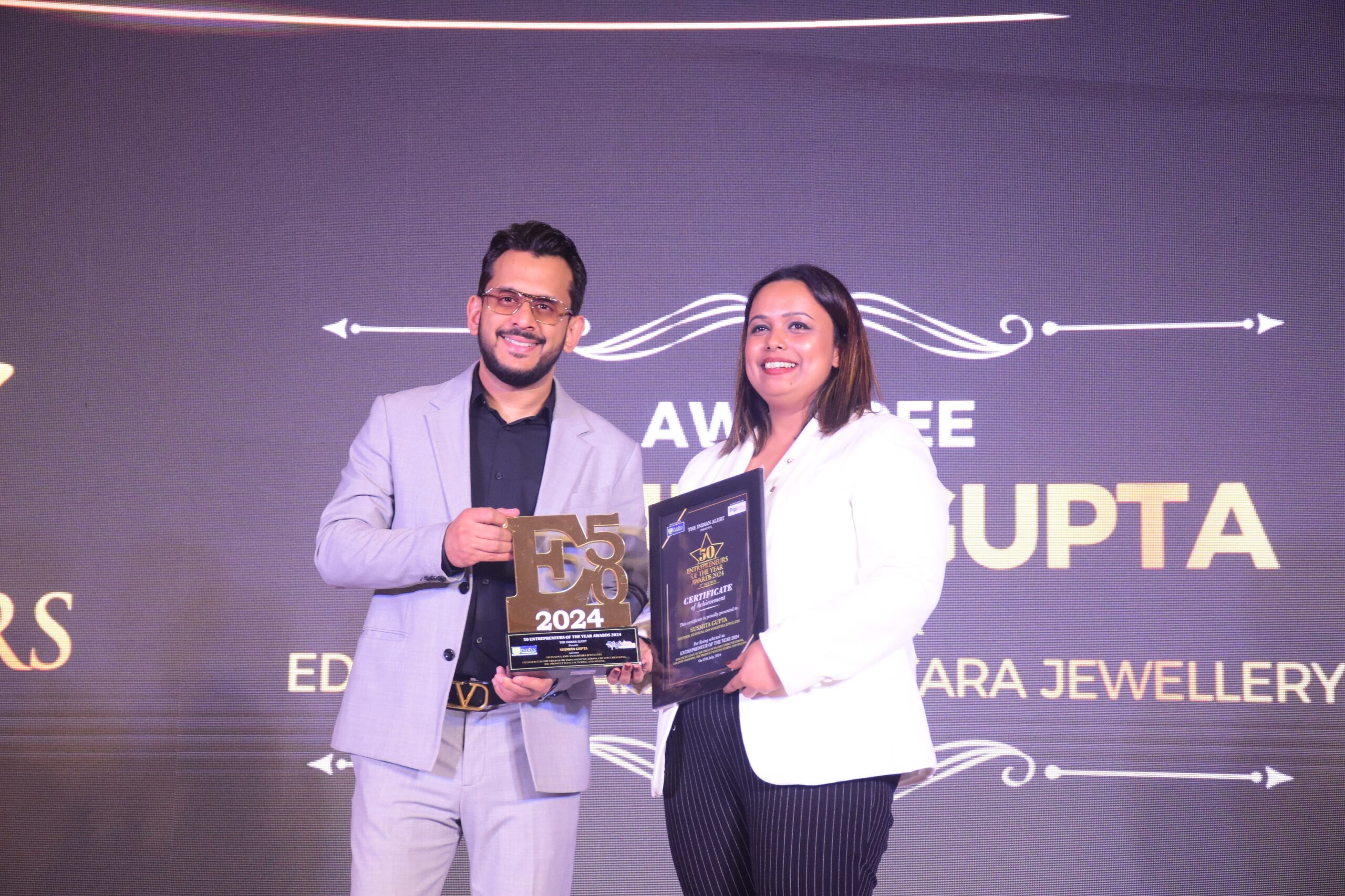 boAt’s Aman Gupta felicitates Susmita Gupta in the 50 Entrepreneur of the Year Awards 2024